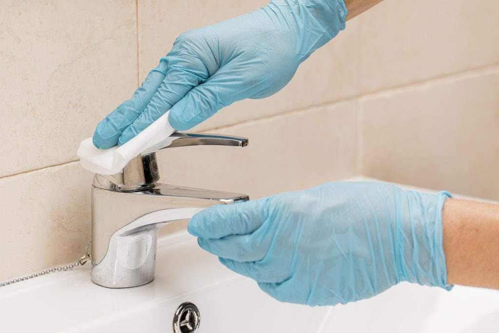 how to clean black gunk from faucet