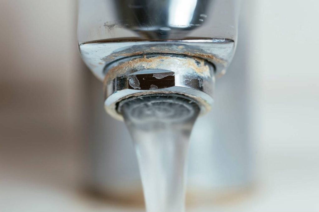 how to remove calcium buildup from faucet